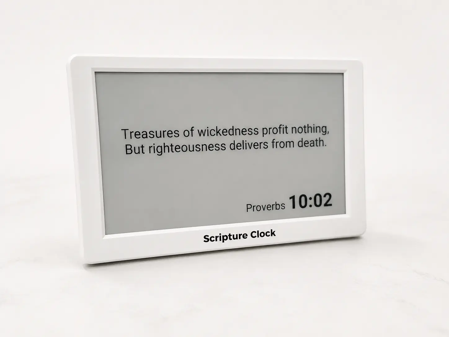 Scripture Clock in matte white, showing the verse for the current minute on its e-paper display